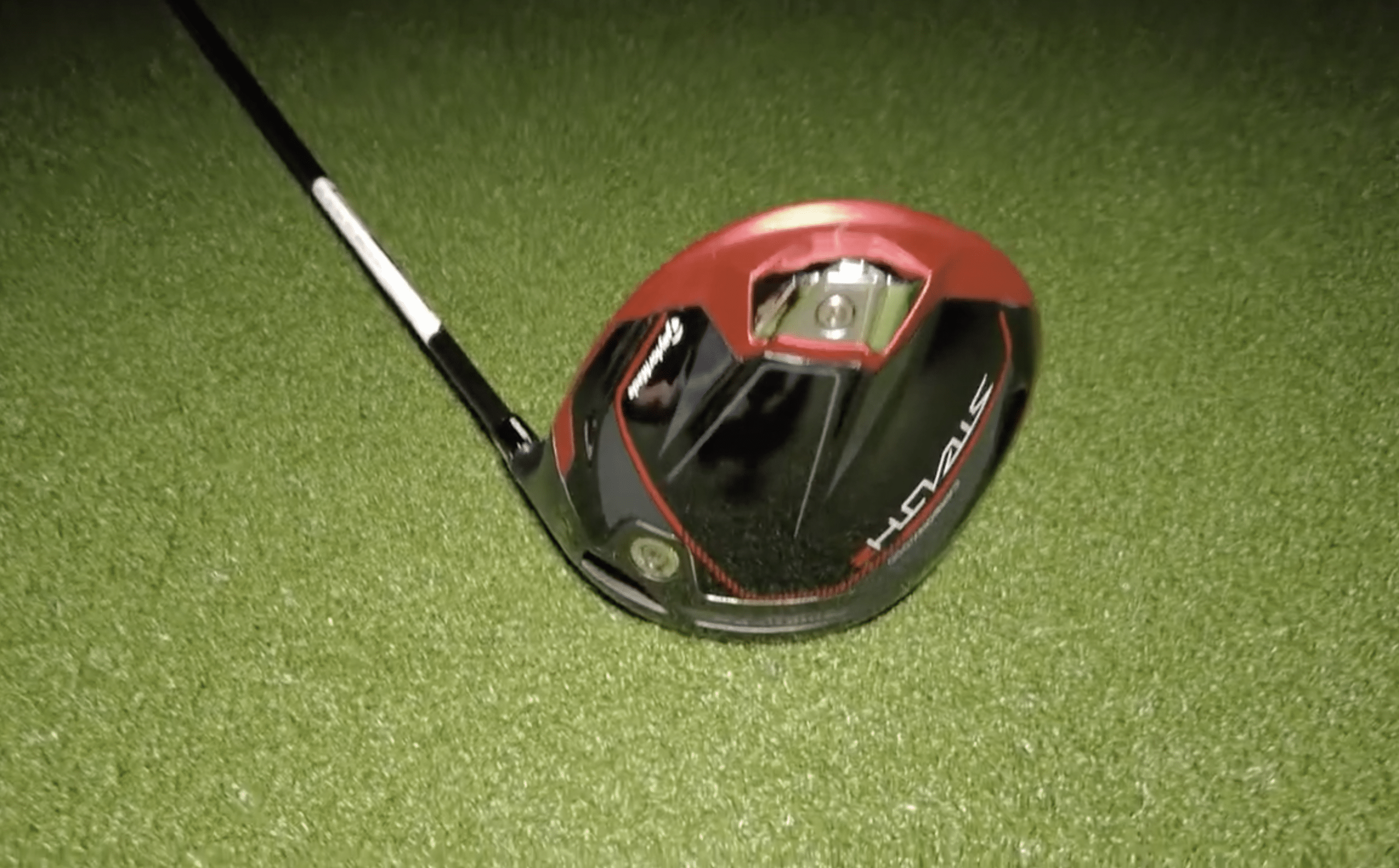 Golf driver club on artificial grass