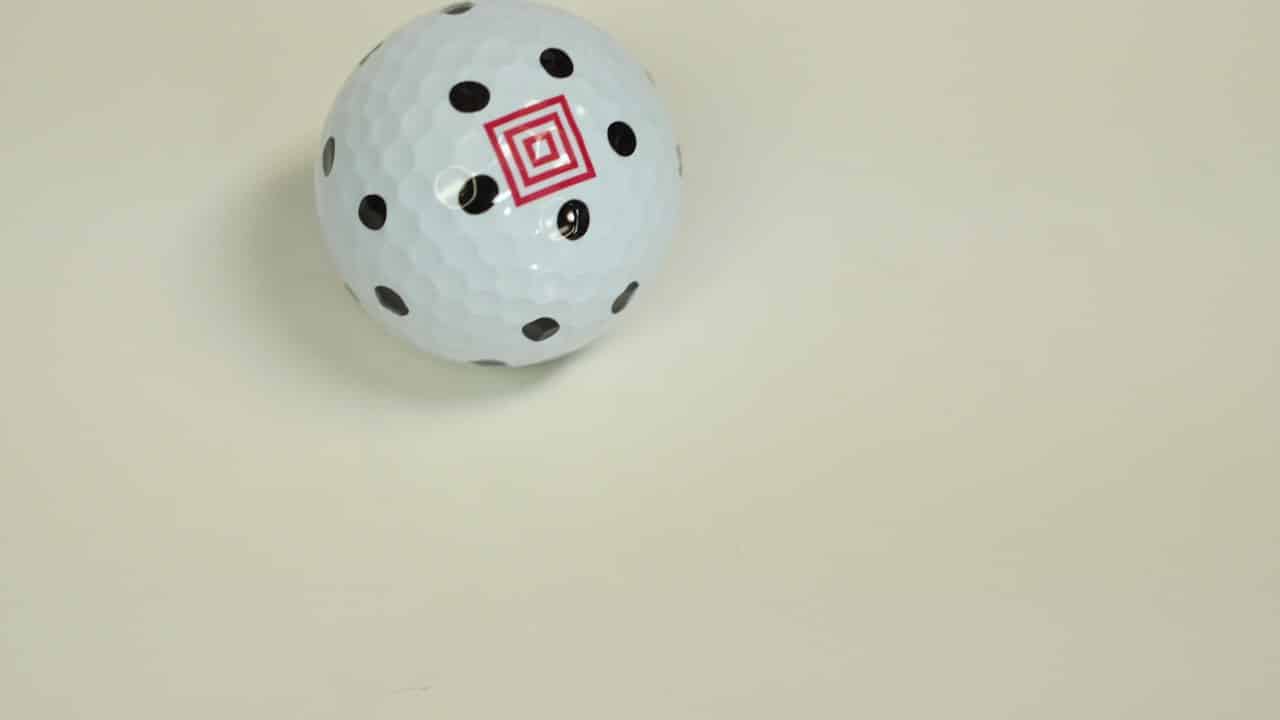 Square Golf dotted marked golf ball close-up showing the Square logo pattern