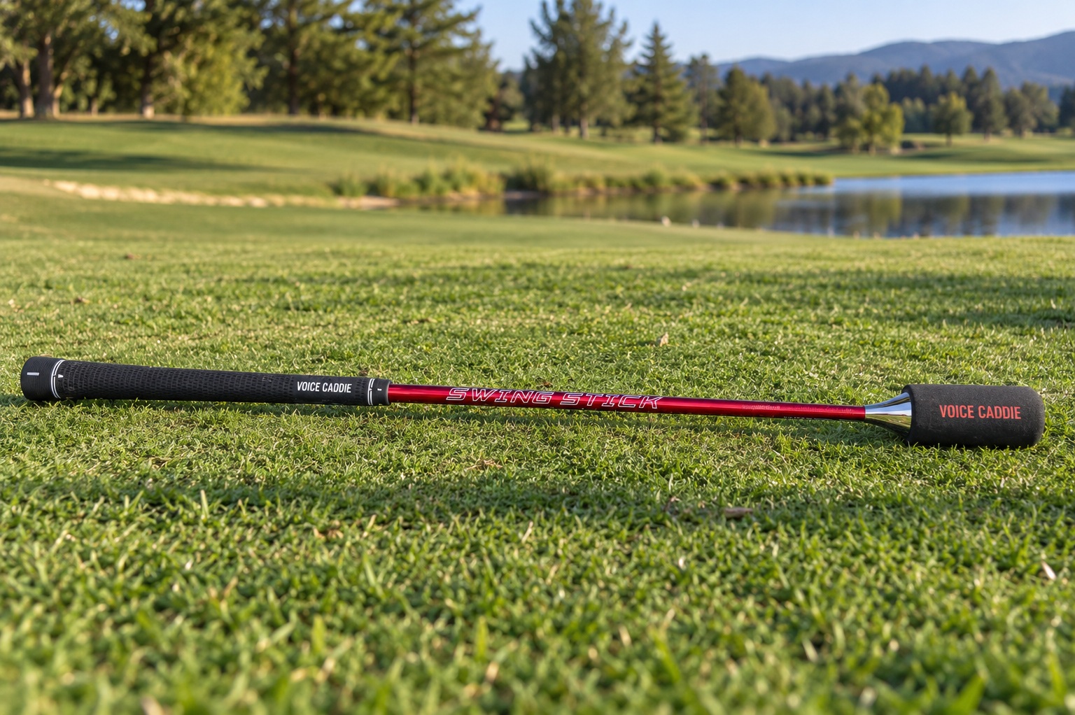 Red golf swing training stick on a green
