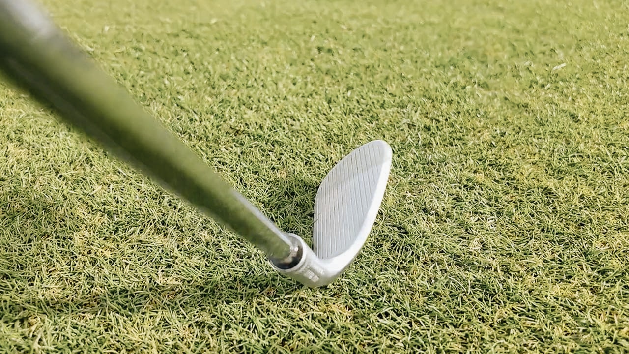 Close-up of a golf club on grass