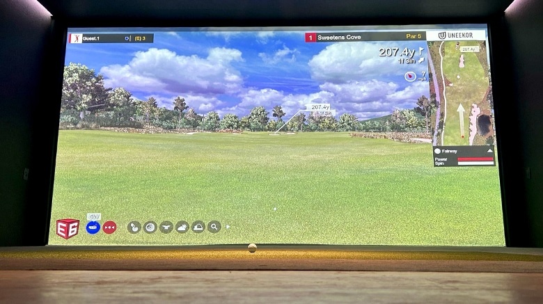 Golf simulator display showing Sweetens Cove course.