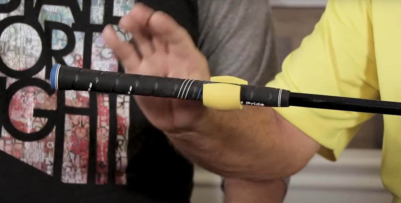 Close-up of a fishing rod with handle details.
