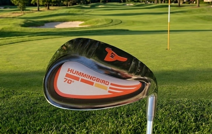 Hummingbird 70-degree golf club displayed on a putting green