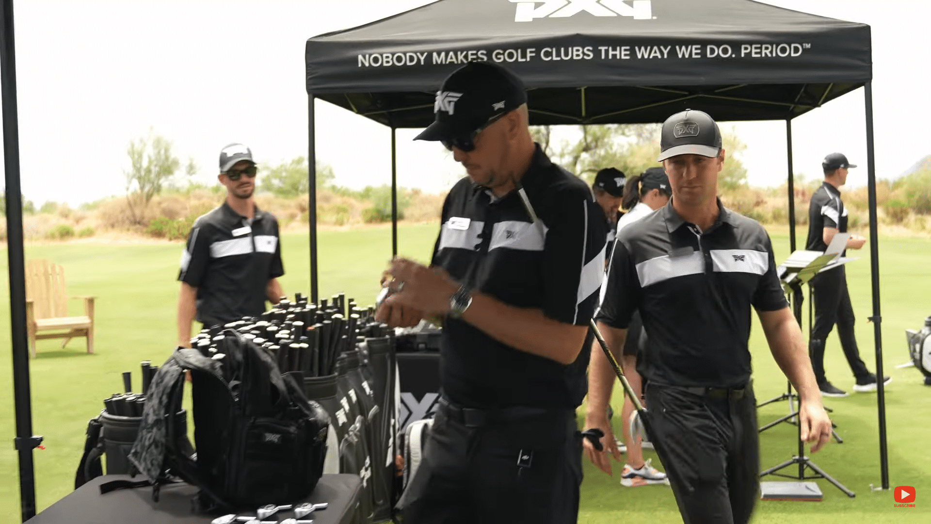 Golf professionals at a PXG event.
