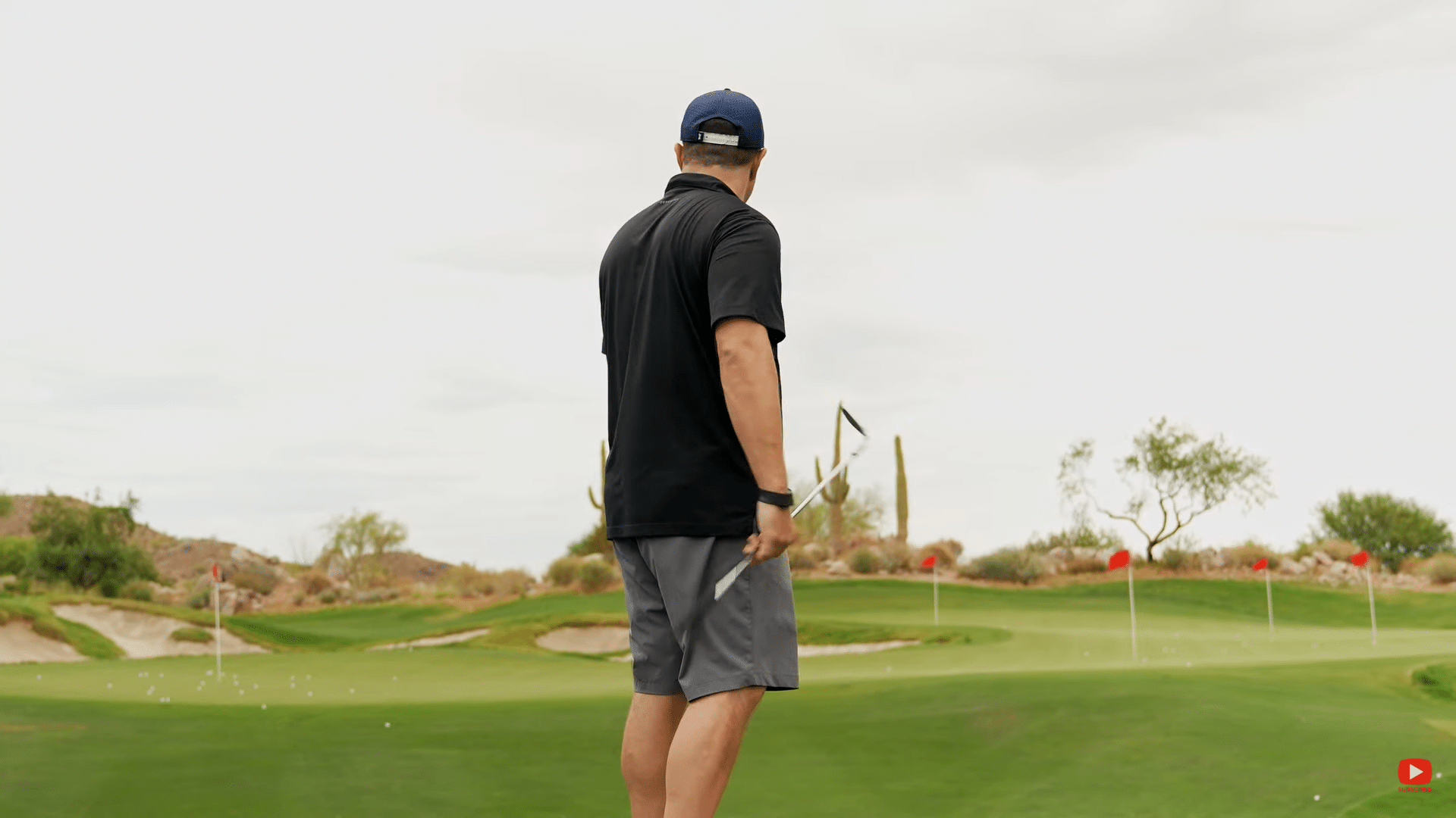 Golfer preparing to make a shot on the green.