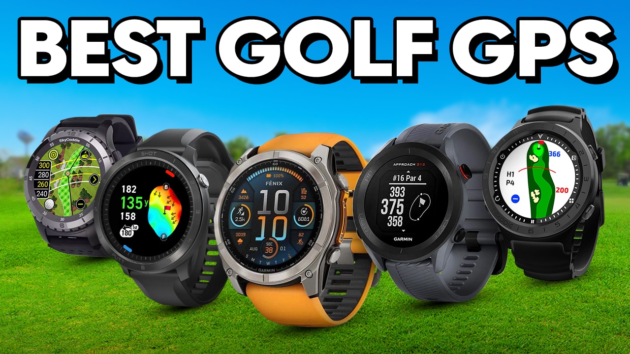 Five golf GPS watches on grass background