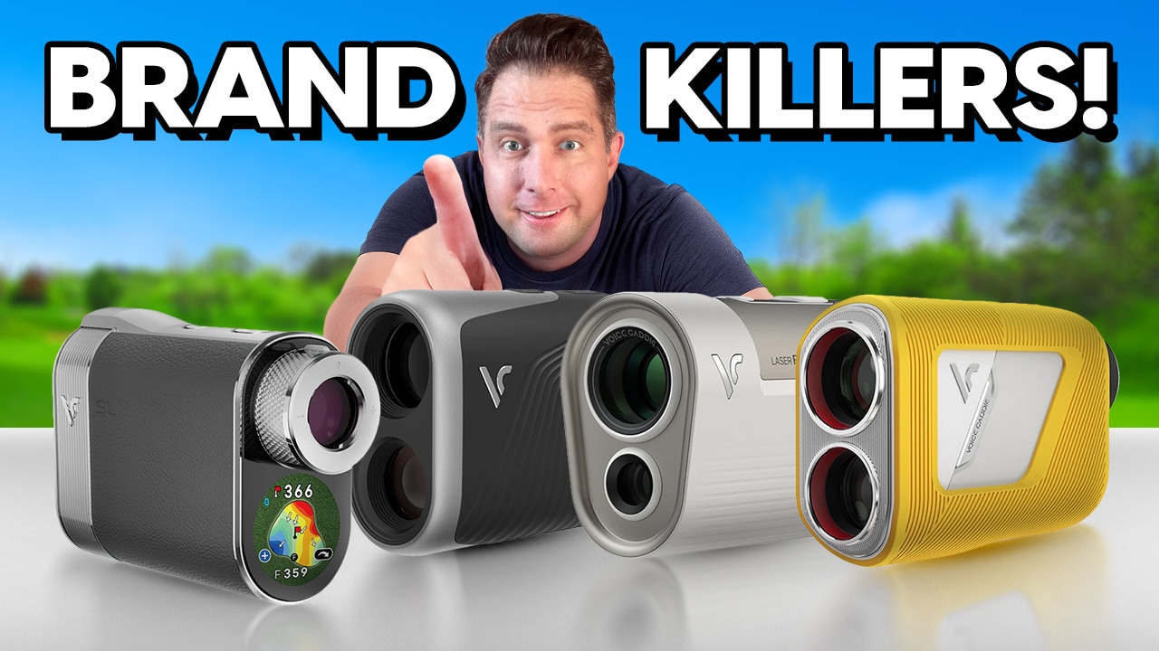 Man pointing behind four golf rangefinders
