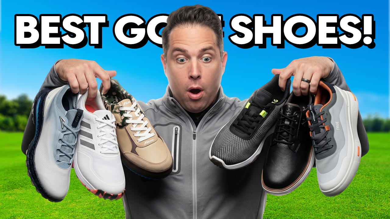 Man holding multiple golf shoes with surprised expression
