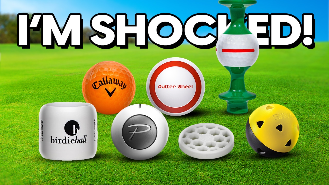 Golf practice balls and training aids on grass