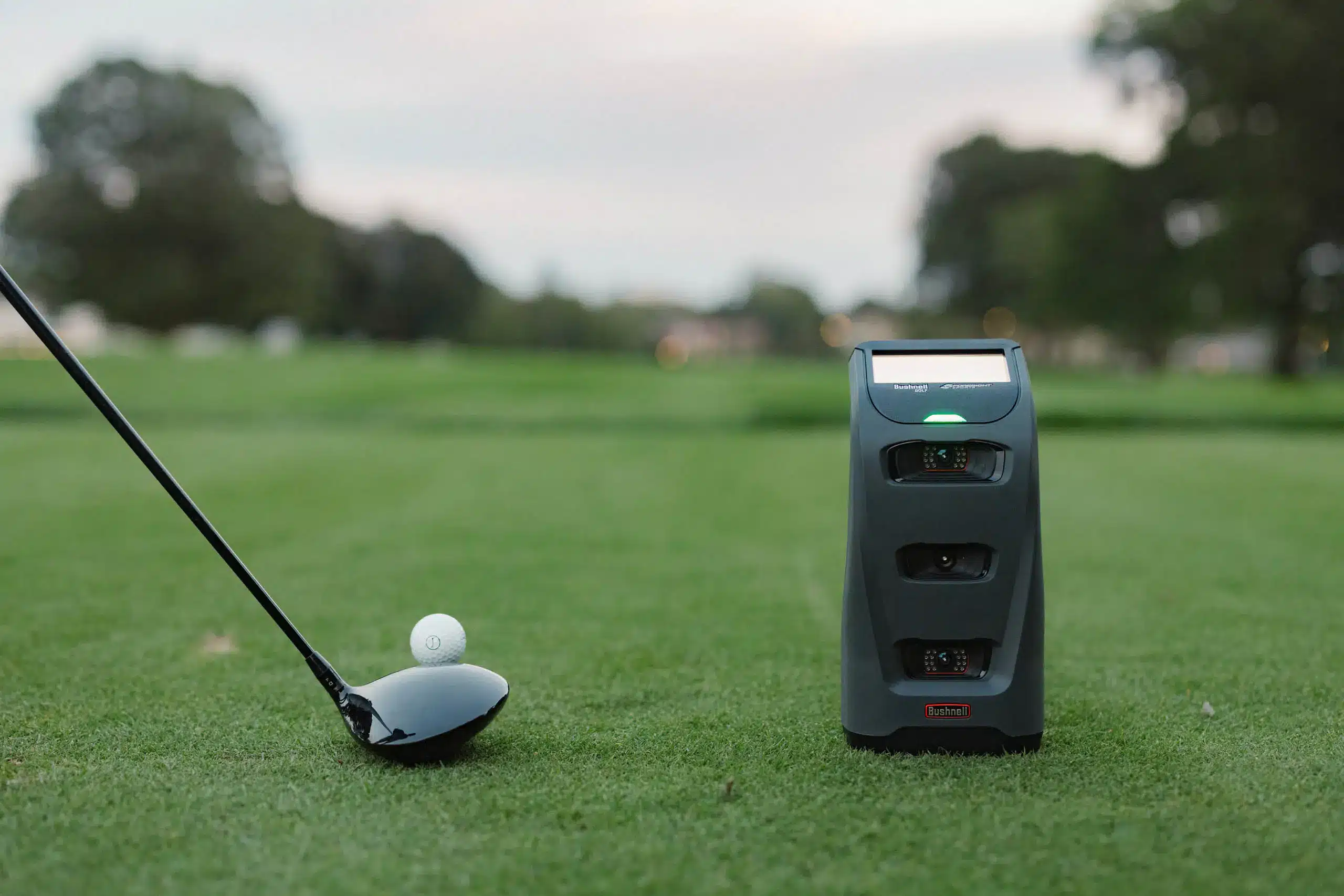 Golf club, ball, and launch monitor on course