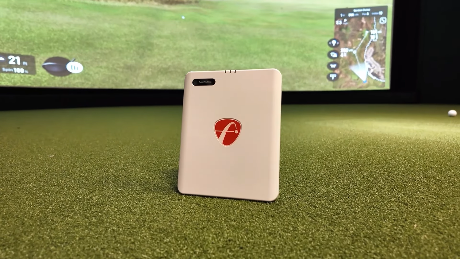 Golf launch monitor on indoor simulator turf