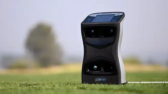 Golf launch monitor on grass field