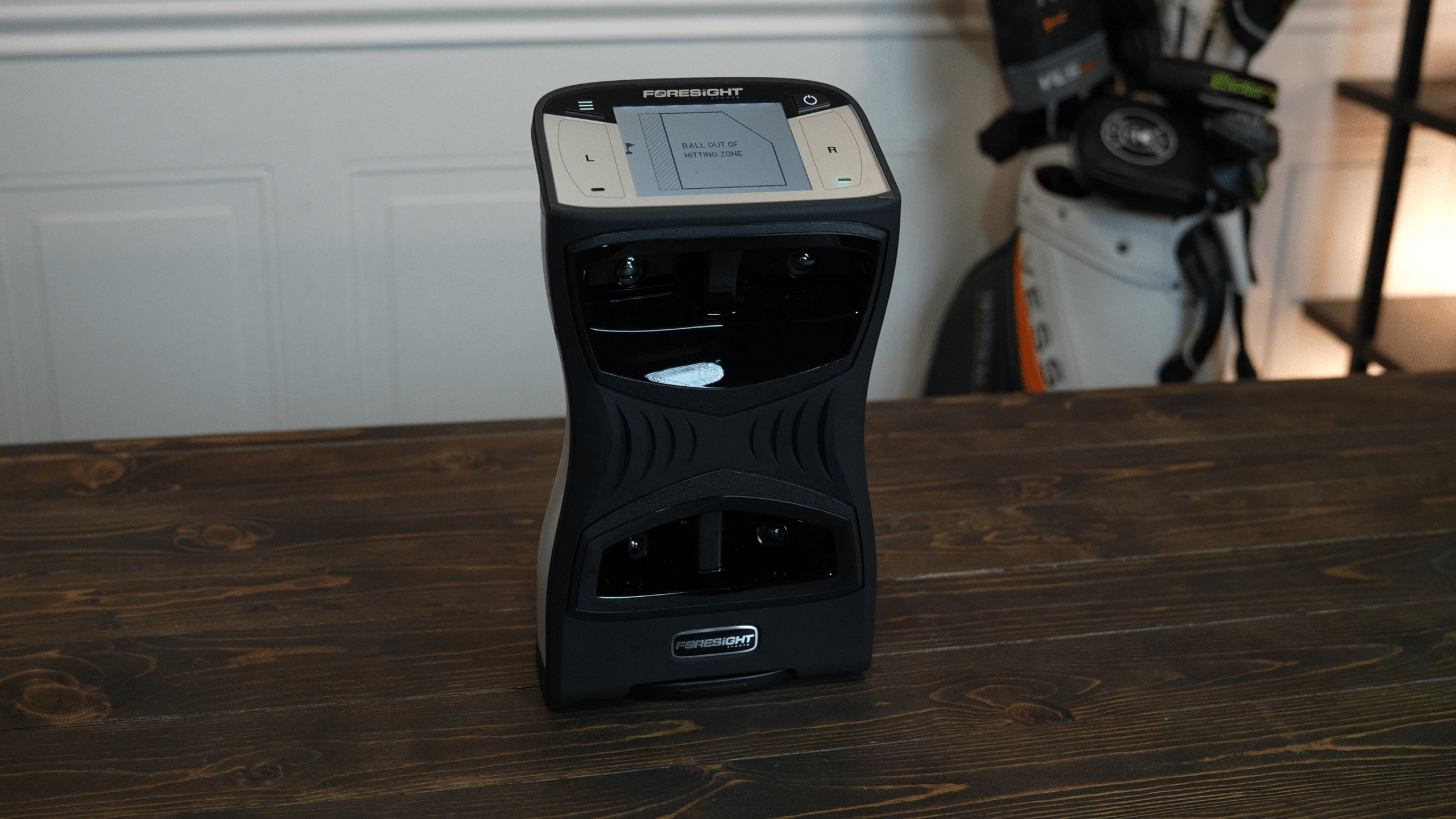 Foresight golf launch monitor on wooden table
