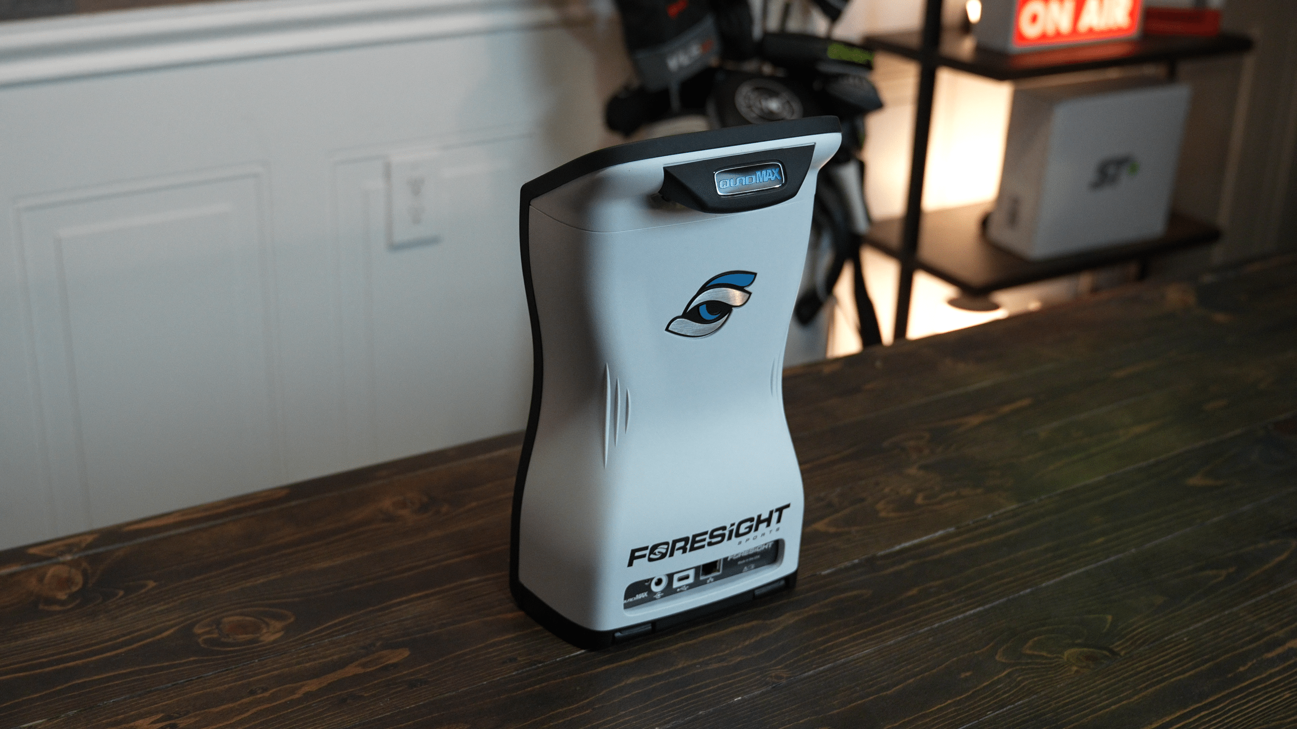 Foresight golf launch monitor on wooden table