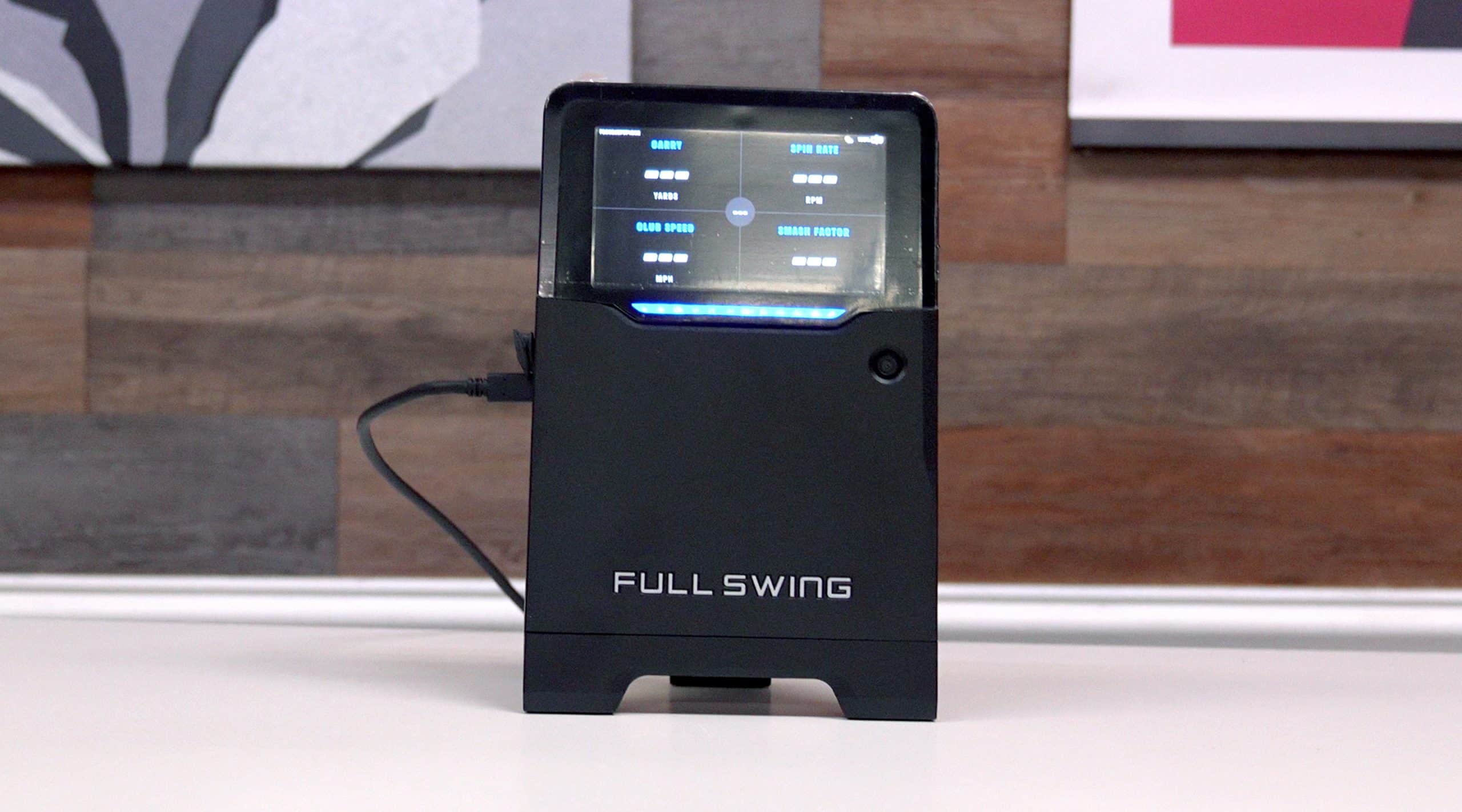 Full Swing golf launch monitor on desk