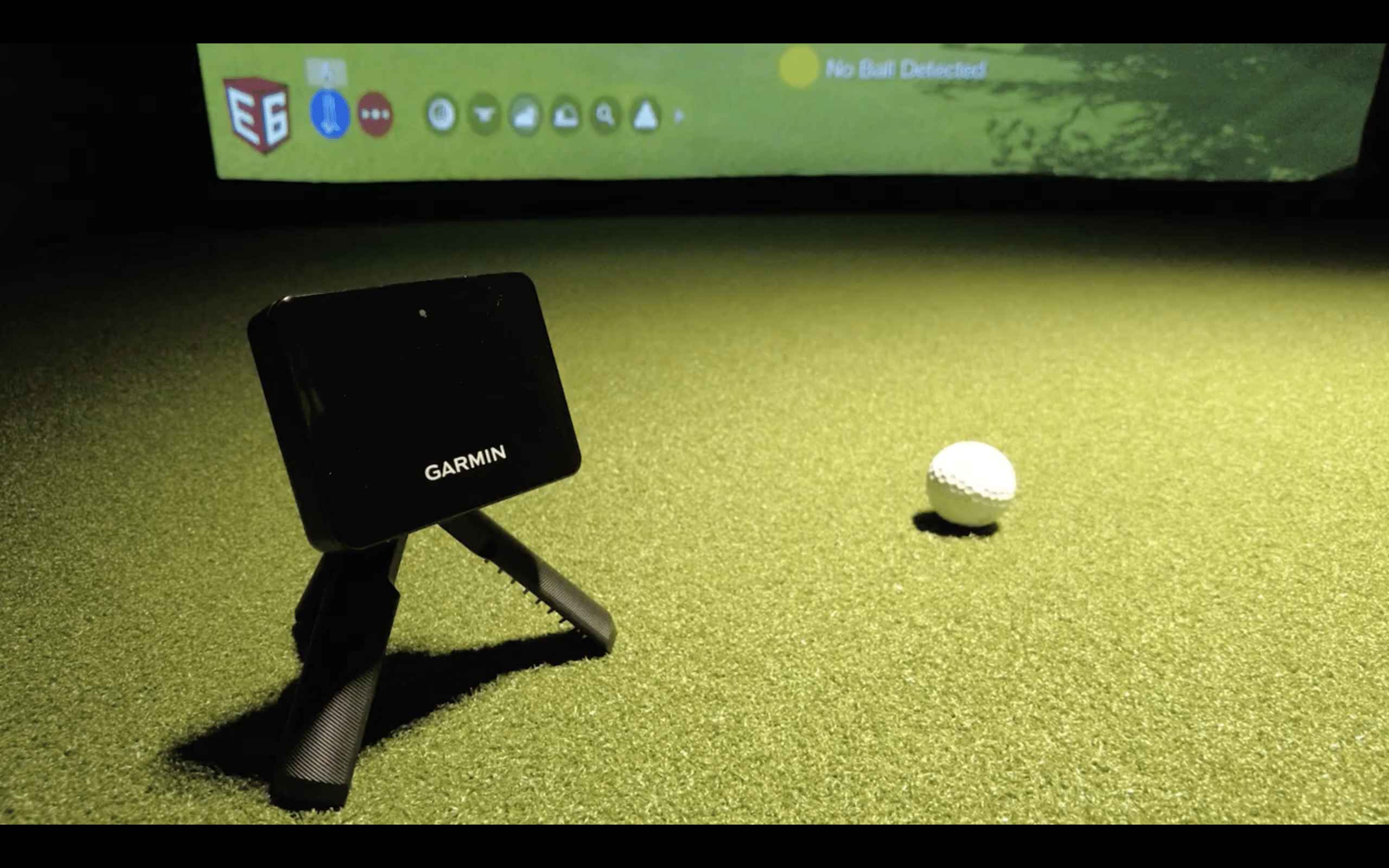 Garmin golf simulator with ball on turf