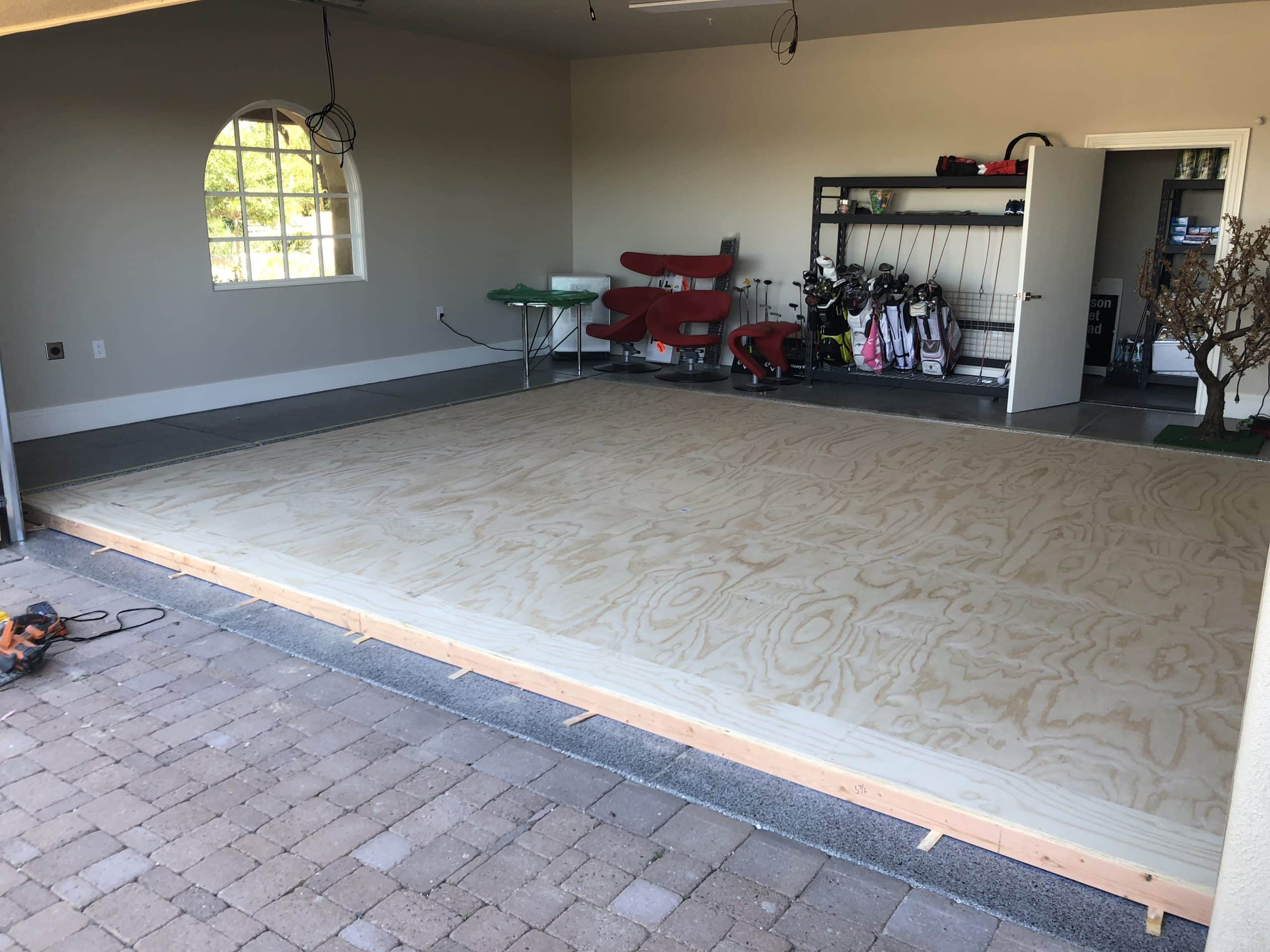 Wood platform built inside residential garage space