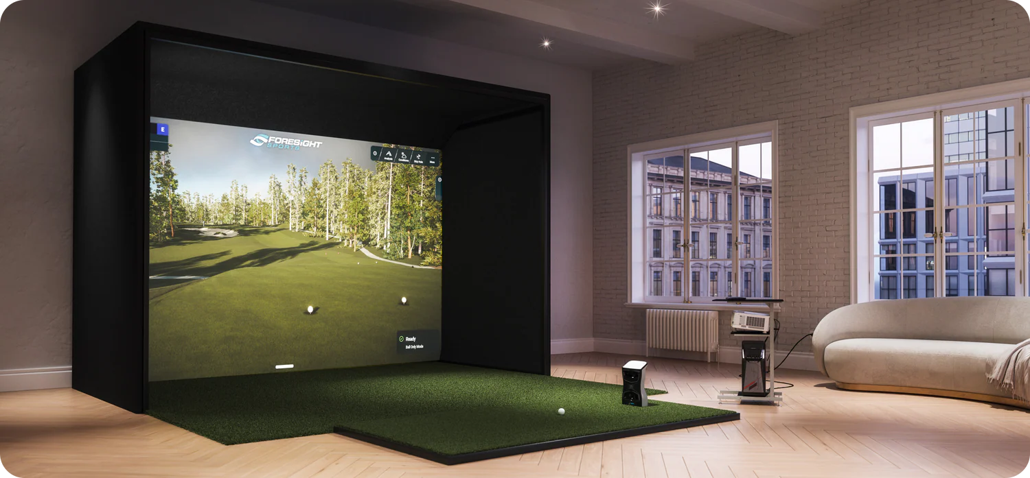 Indoor golf simulator setup with screen and projector