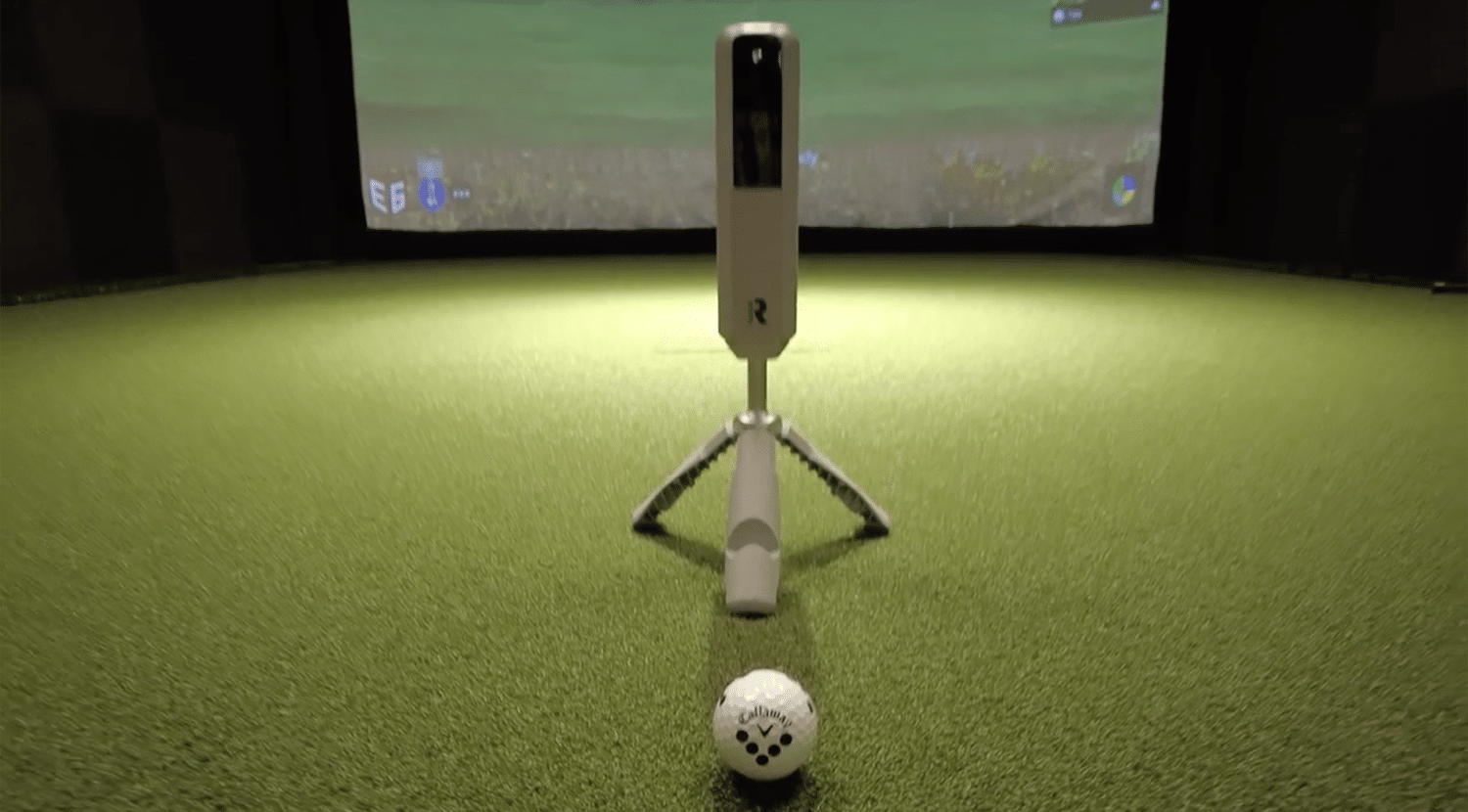 Golf simulator setup with ball and launch monitor