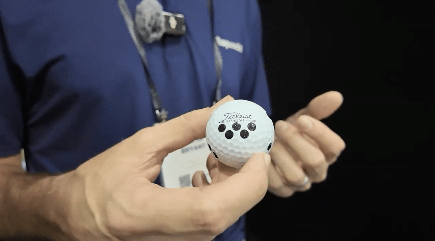 Person holding Titleist Pro V1 golf ball