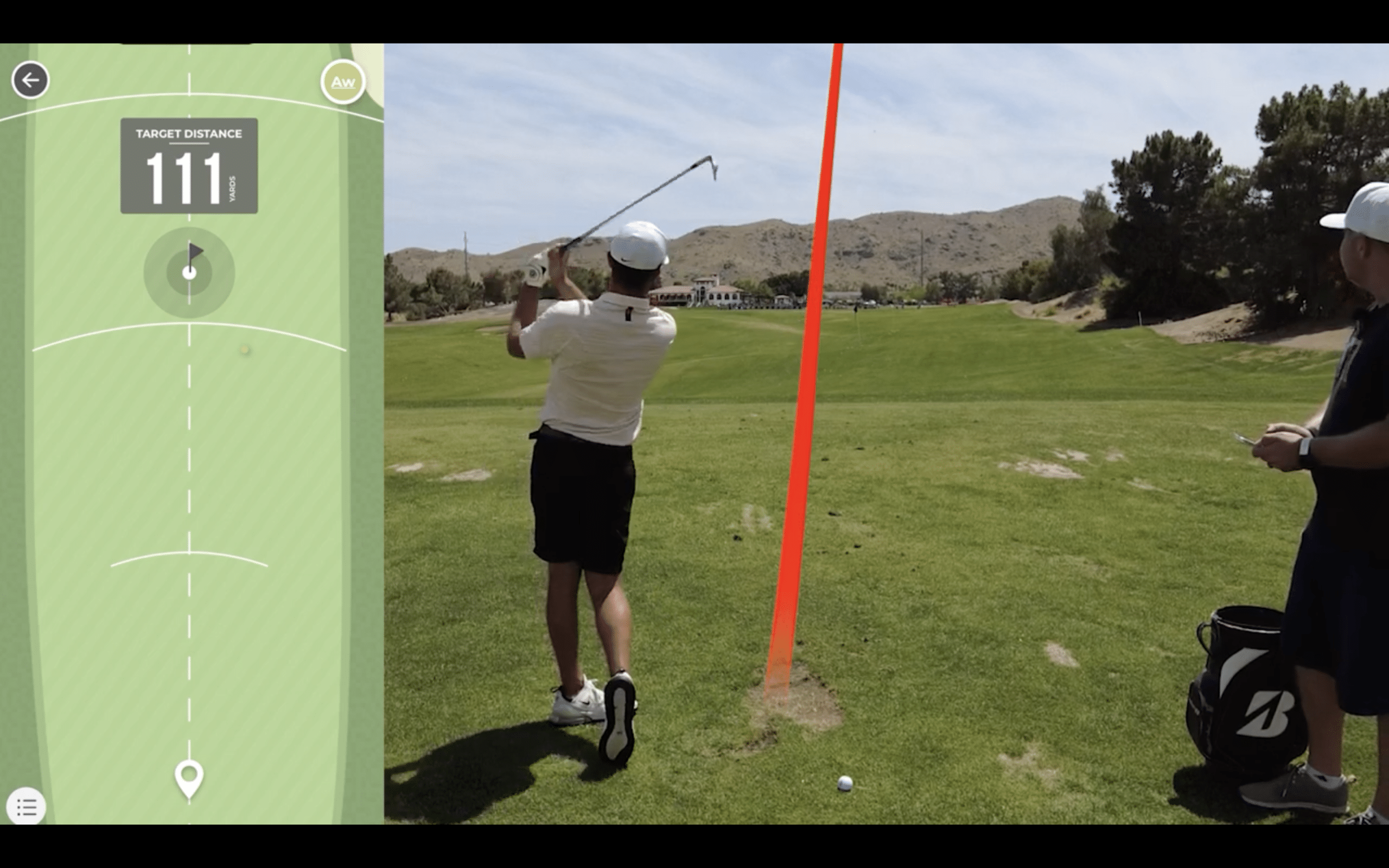 Golfer hits iron shot toward green target distance 111.