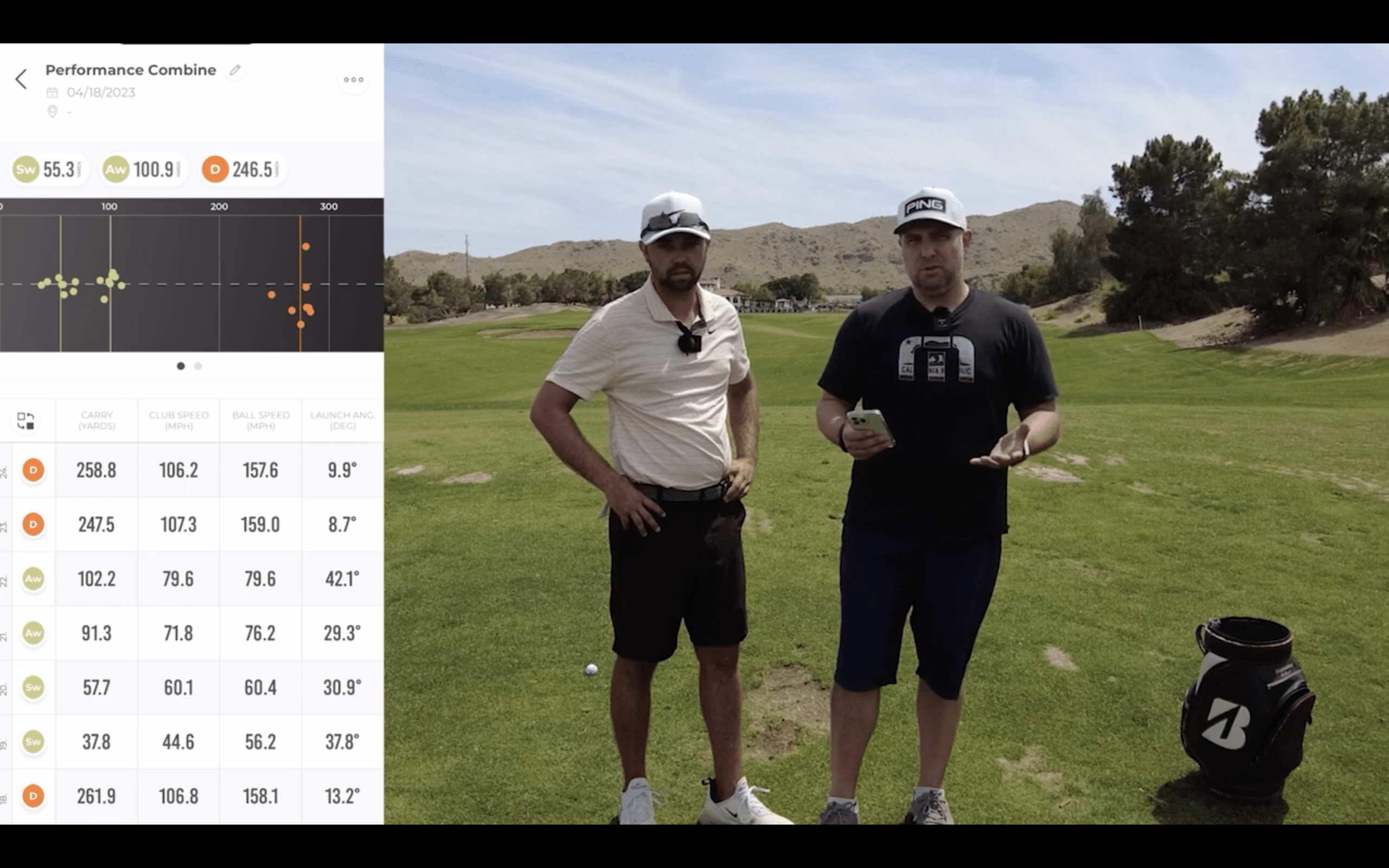 Two golfers reviewing performance stats on driving range.