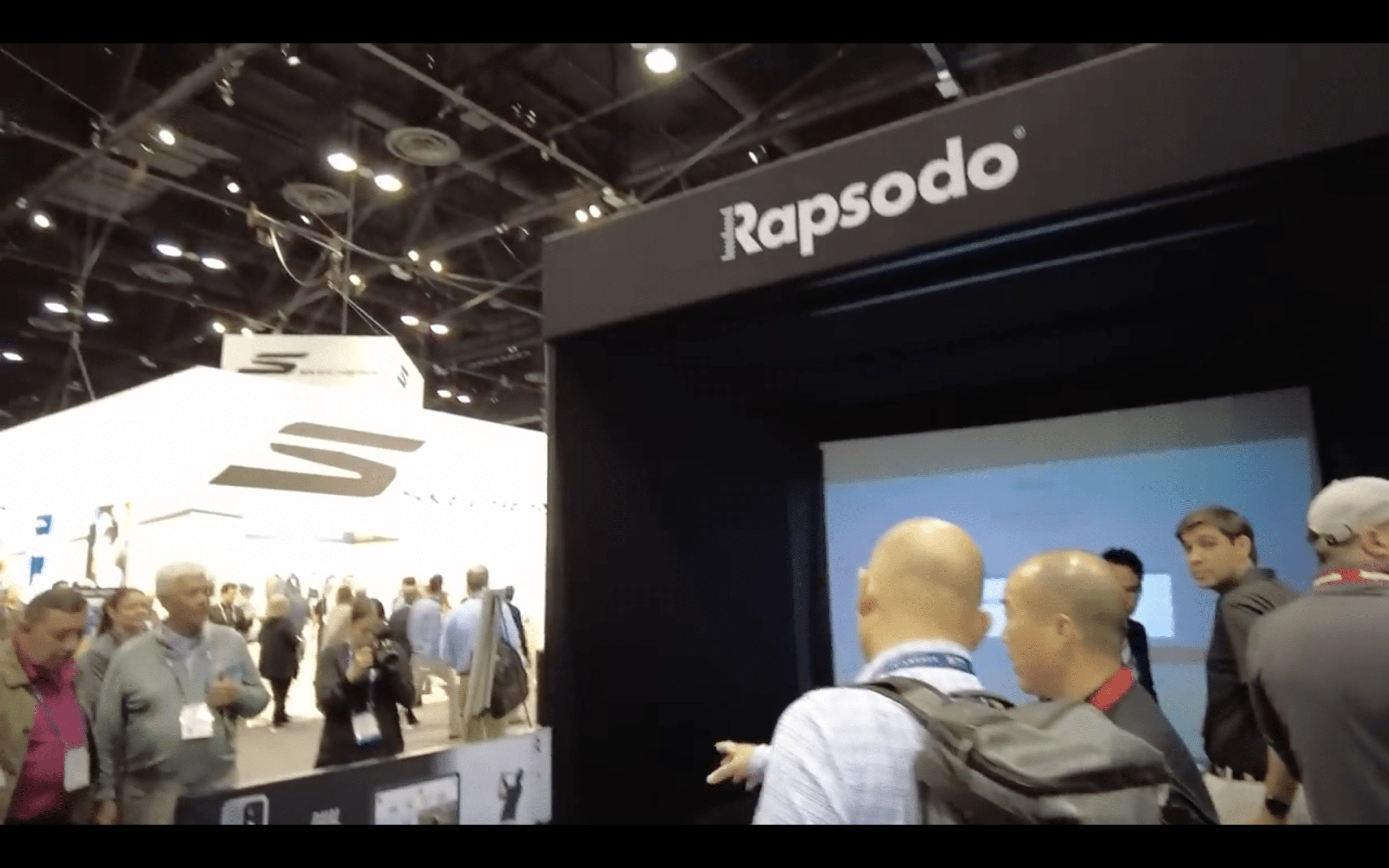 Rapsodo booth at crowded trade show event
