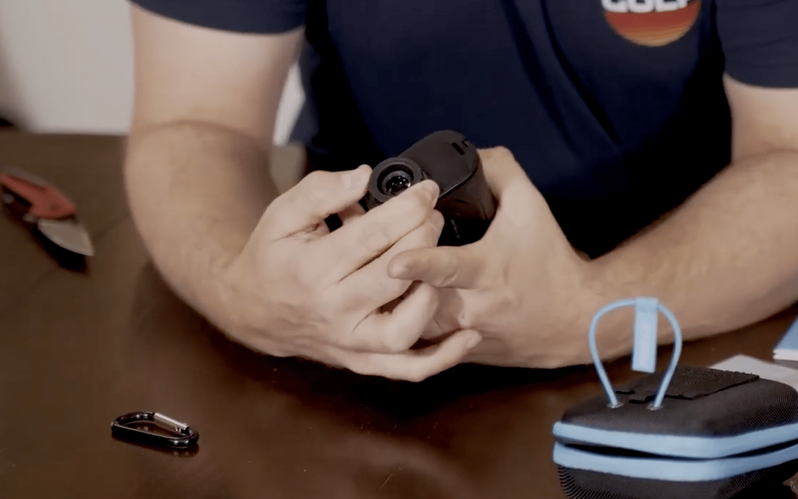 Person holding compact monocular telescope