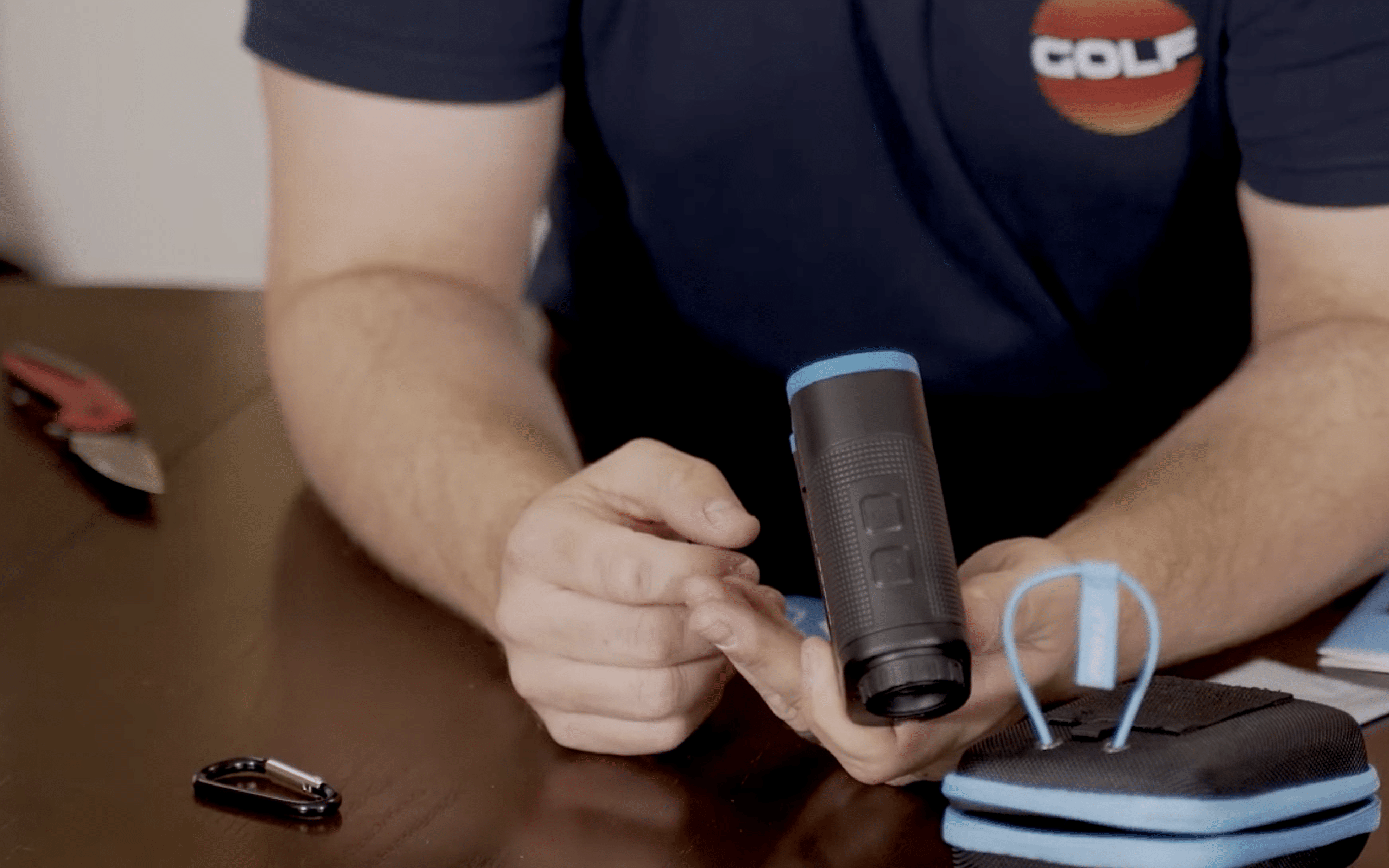 Person holding a black monocular telescope