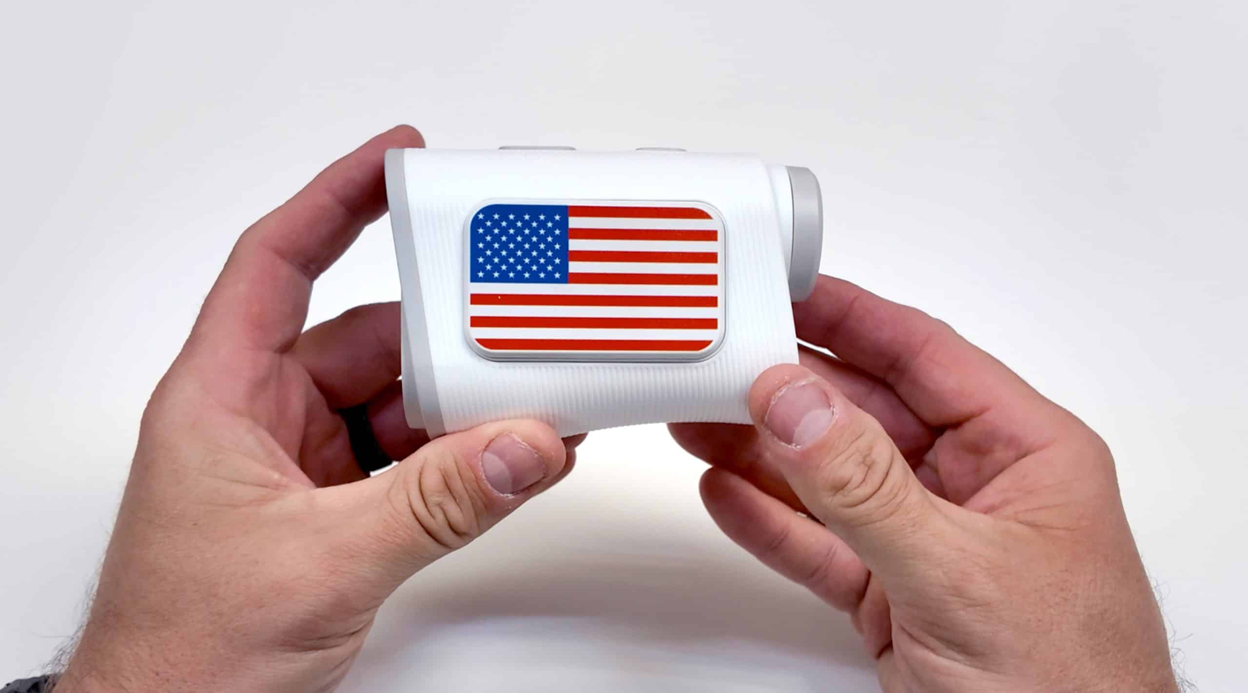 Person holding device with American flag sticker