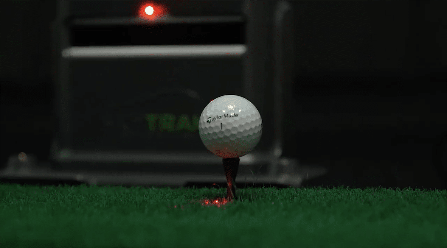 Golf ball on tee with launch monitor