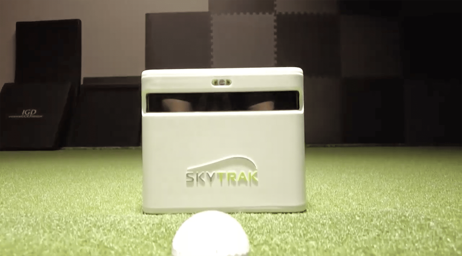 SkyTrak golf launch monitor with golf ball indoors