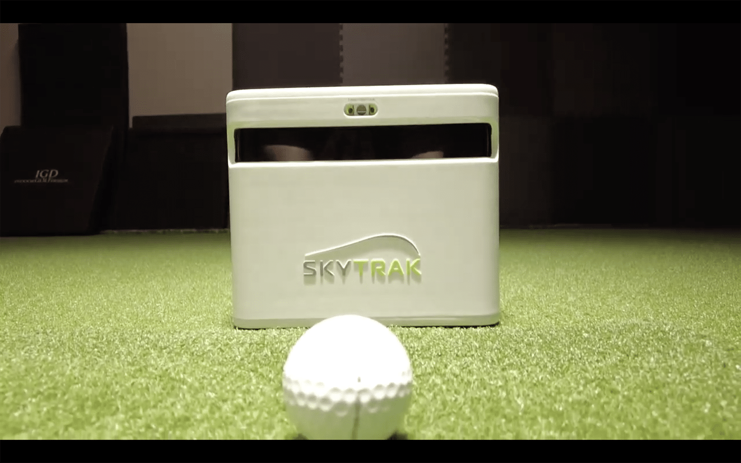 SkyTrak golf launch monitor with golf ball indoors