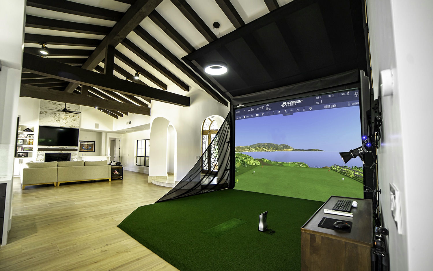 Home golf simulator setup in modern living room