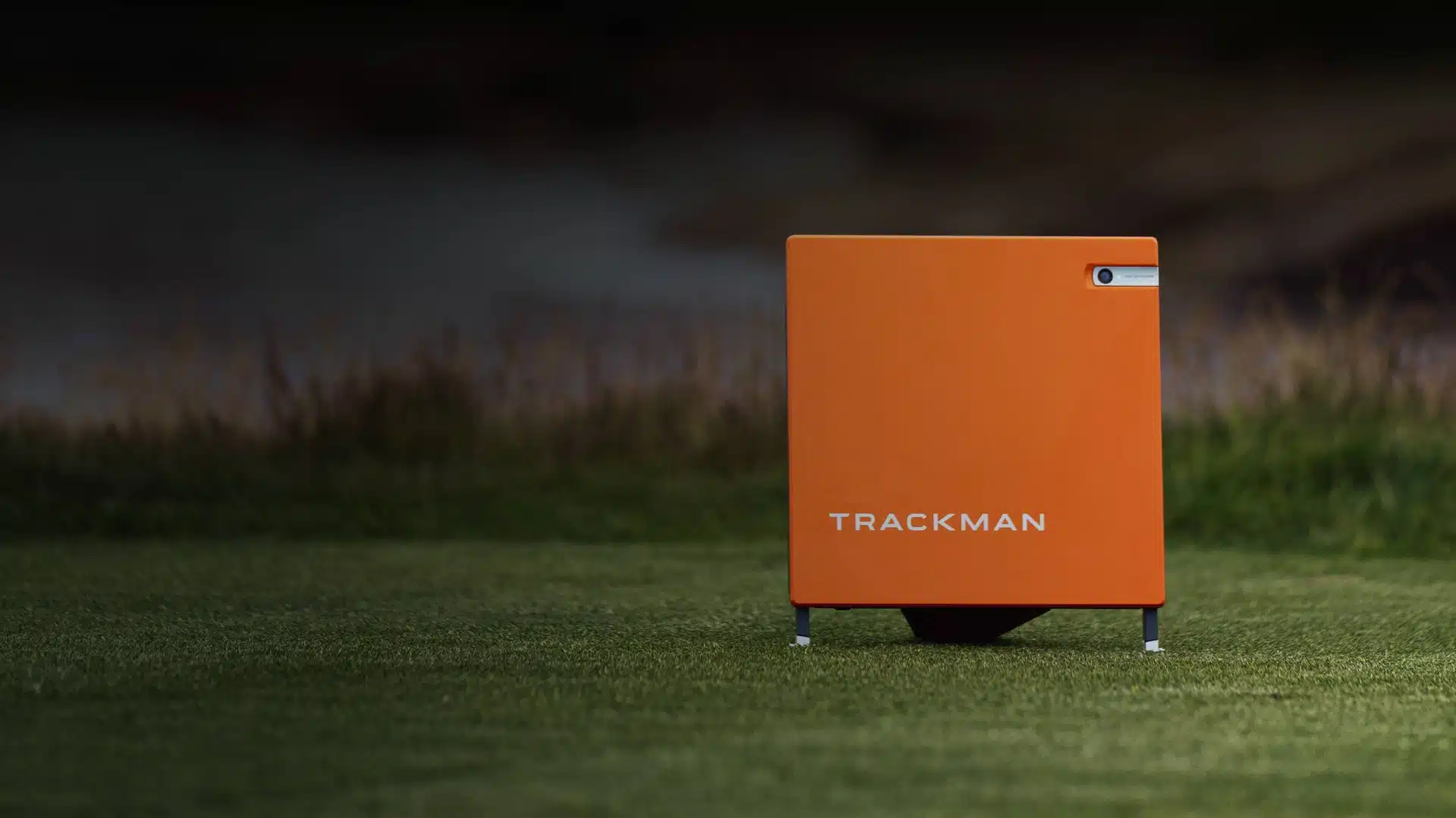 Trackman golf launch monitor on grass field