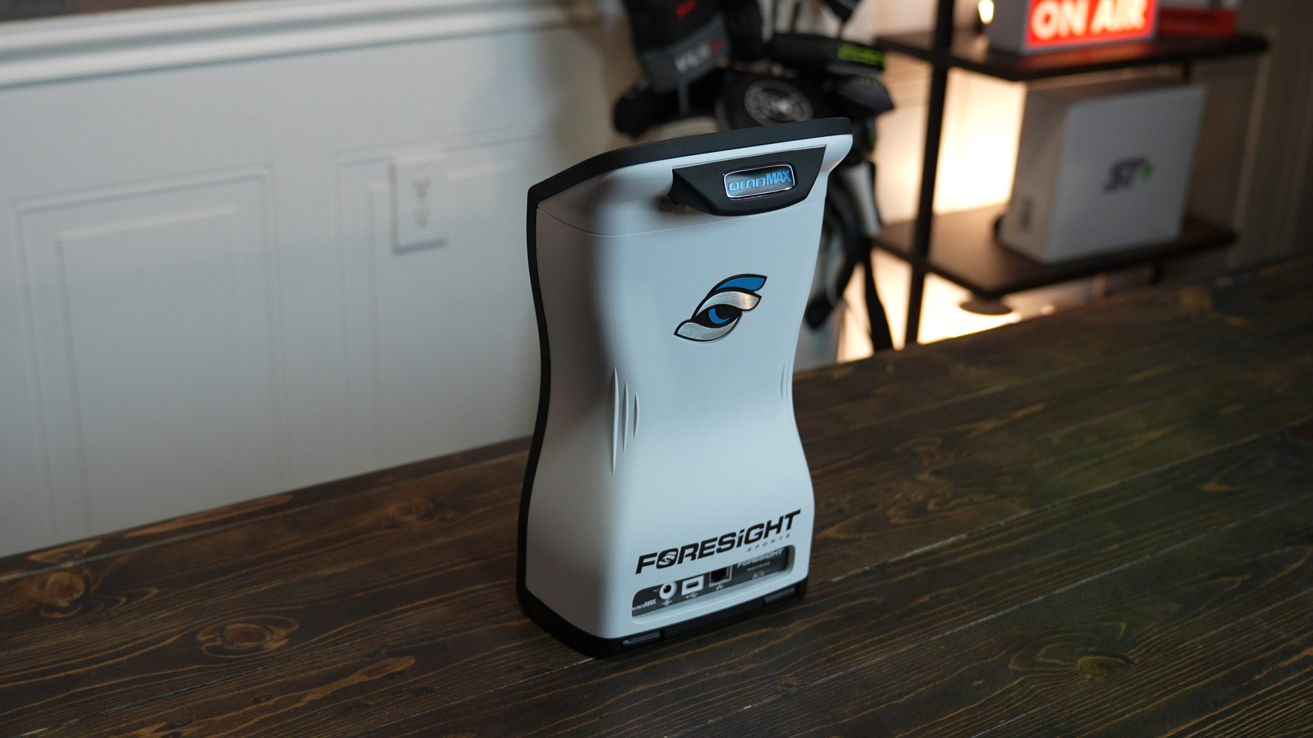 Foresight Sports golf launch monitor on wooden table