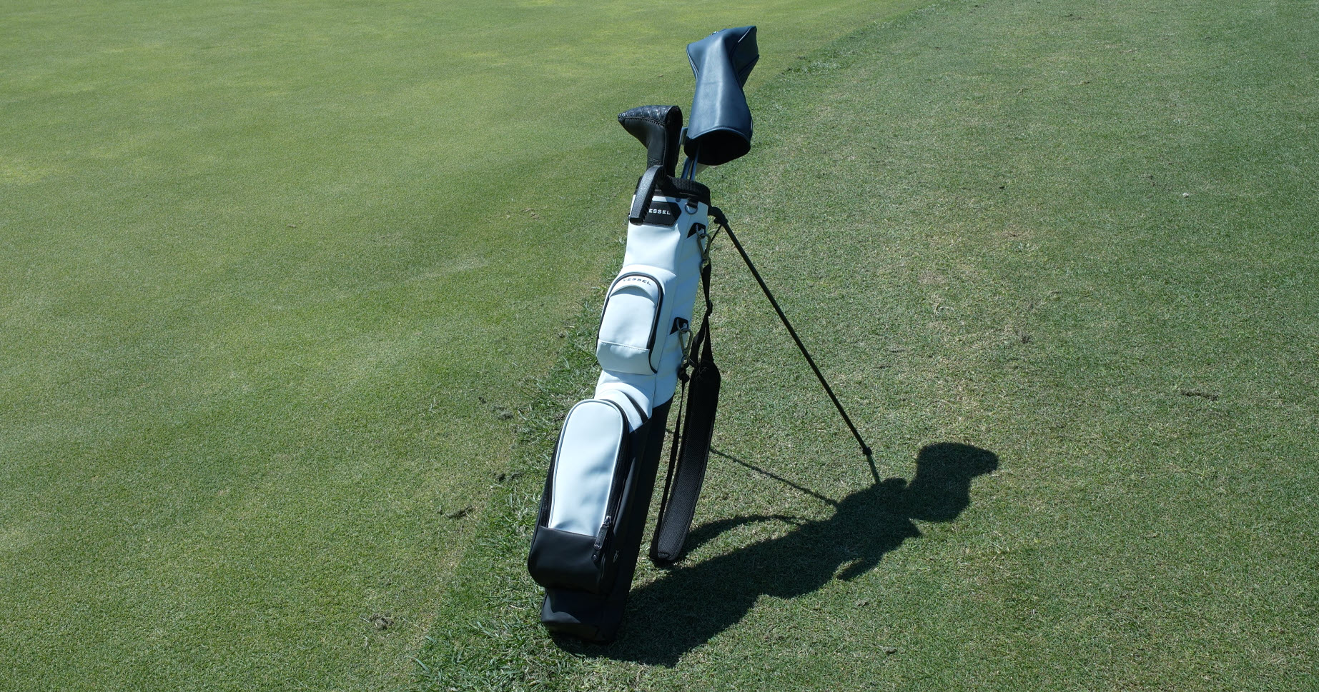 Golf bag on green grass course