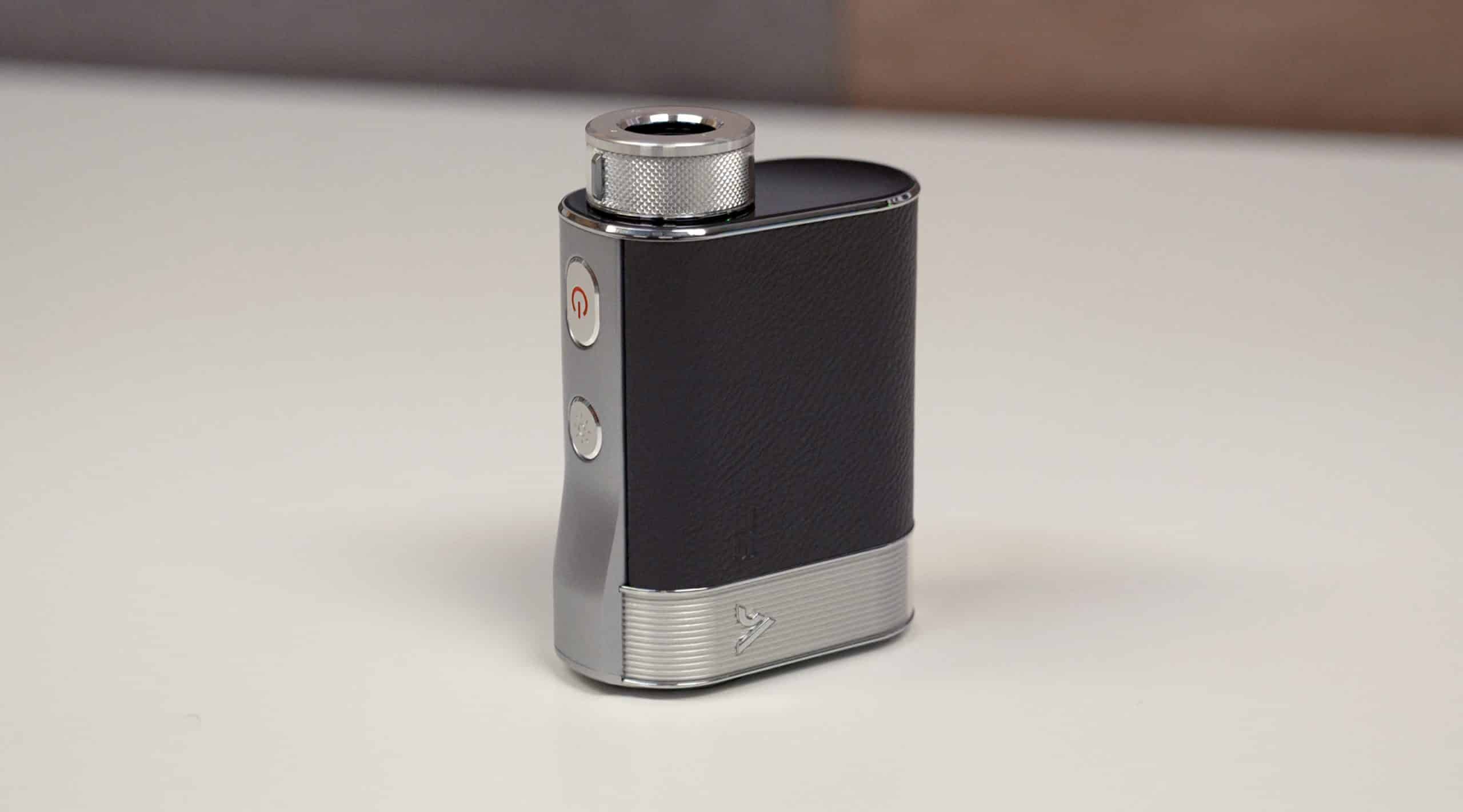 Black and silver portable vaporizer on table