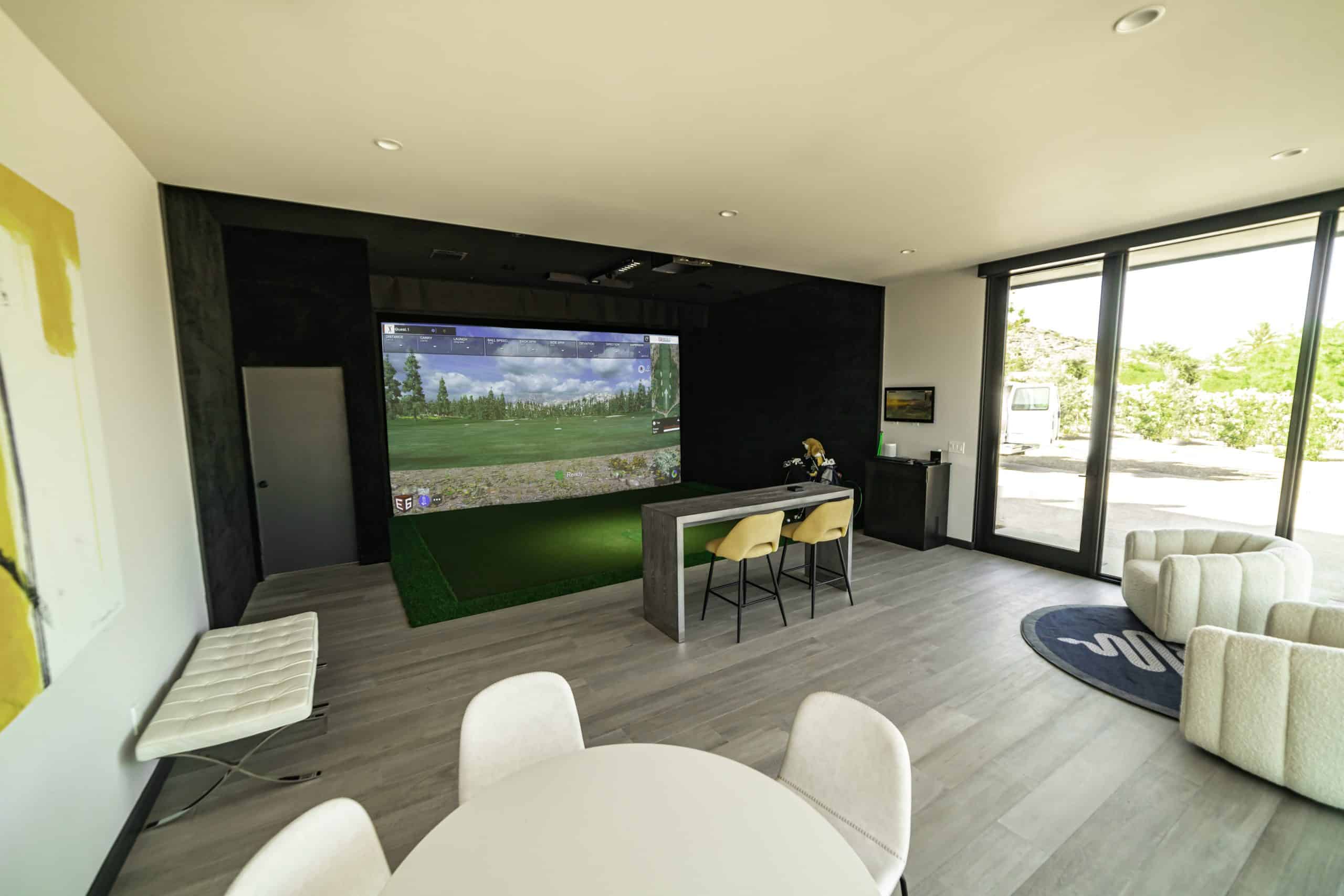 Modern room with indoor golf simulator setup