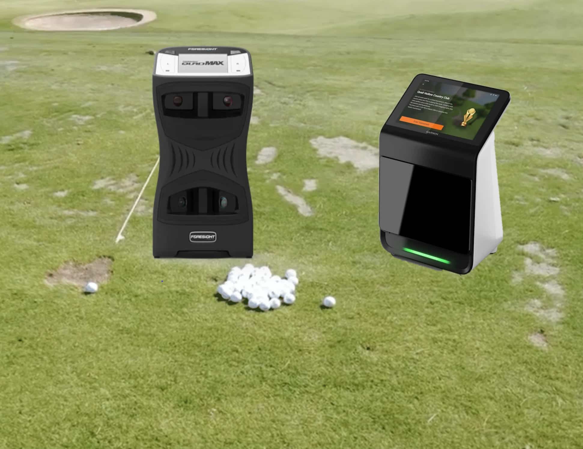 Golf launch monitors on grass near golf balls