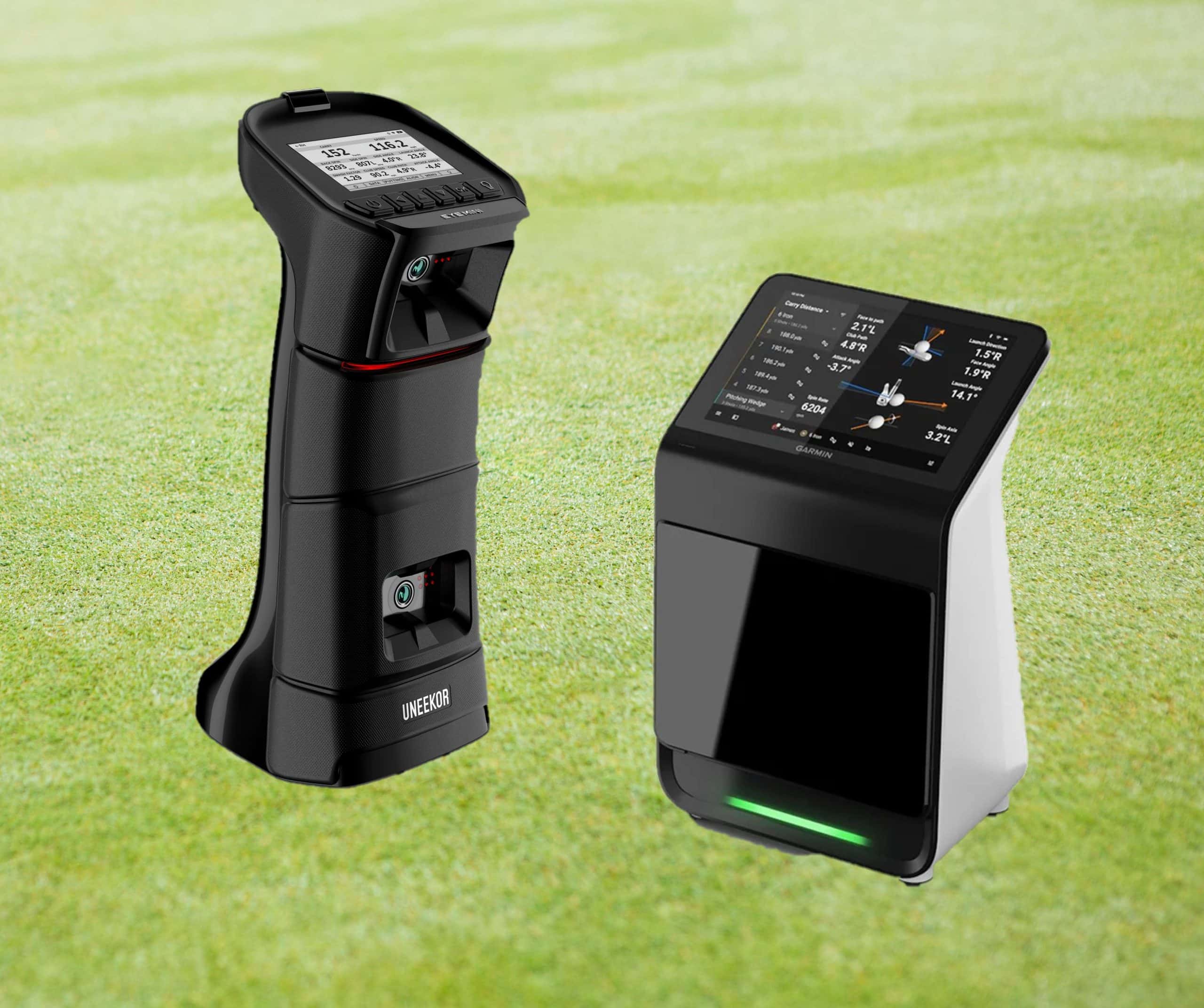 Two golf launch monitors on grass field