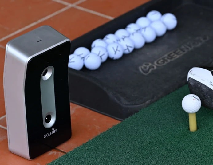 Golf simulator with balls and practice mat