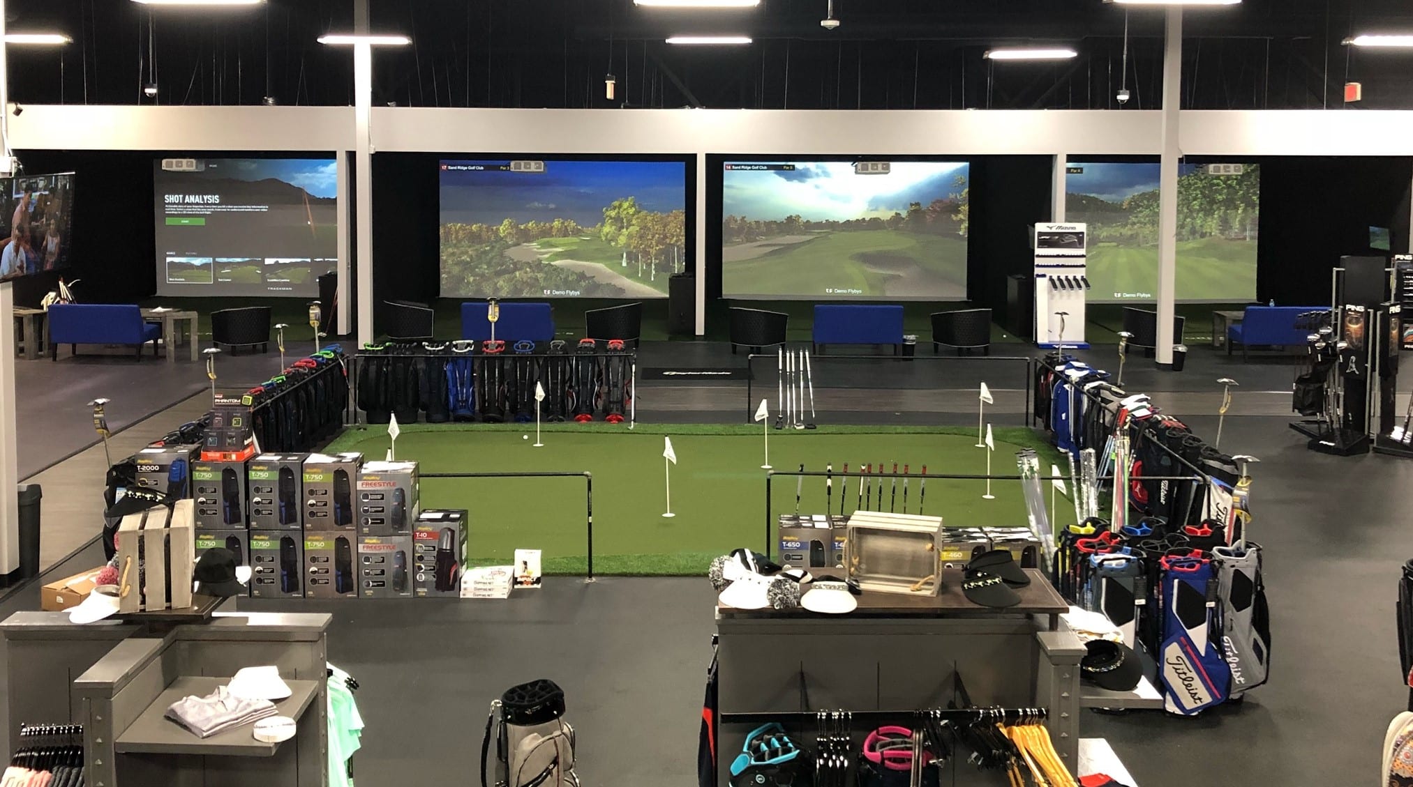 Indoor golf simulator and equipment shop