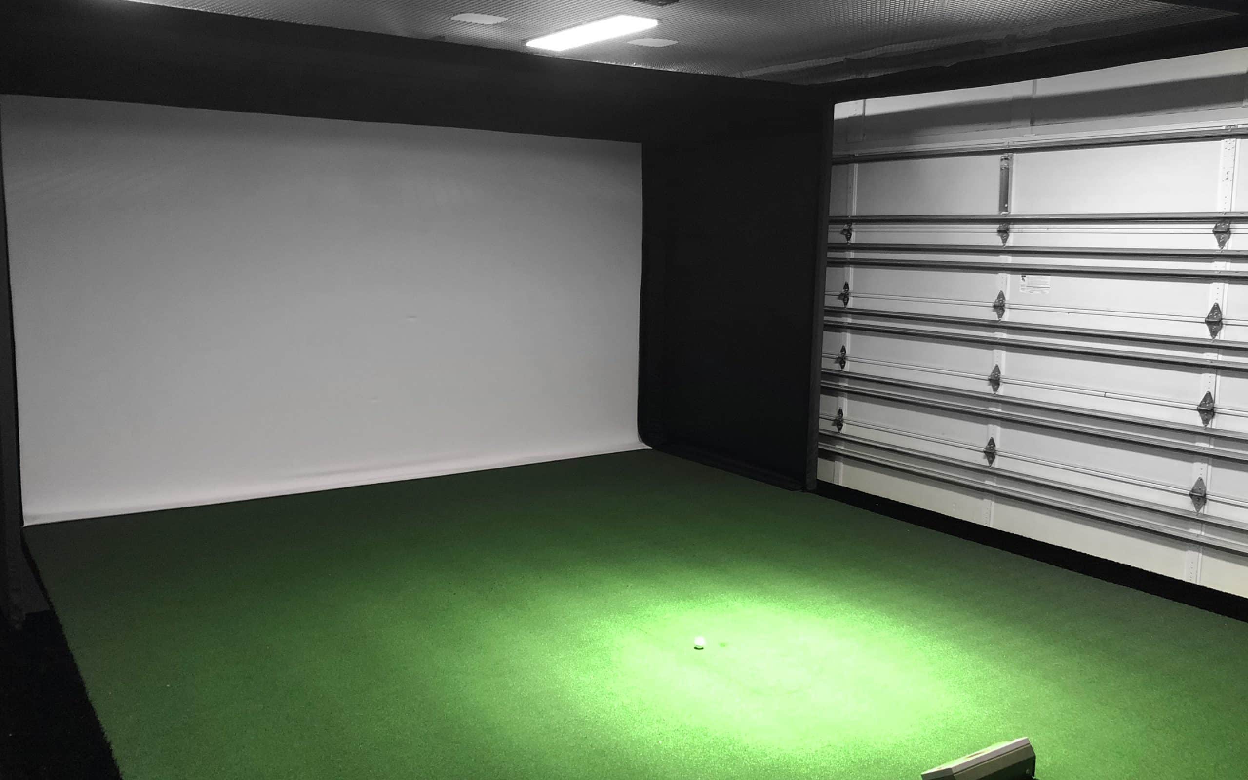 Indoor golf simulator setup in garage