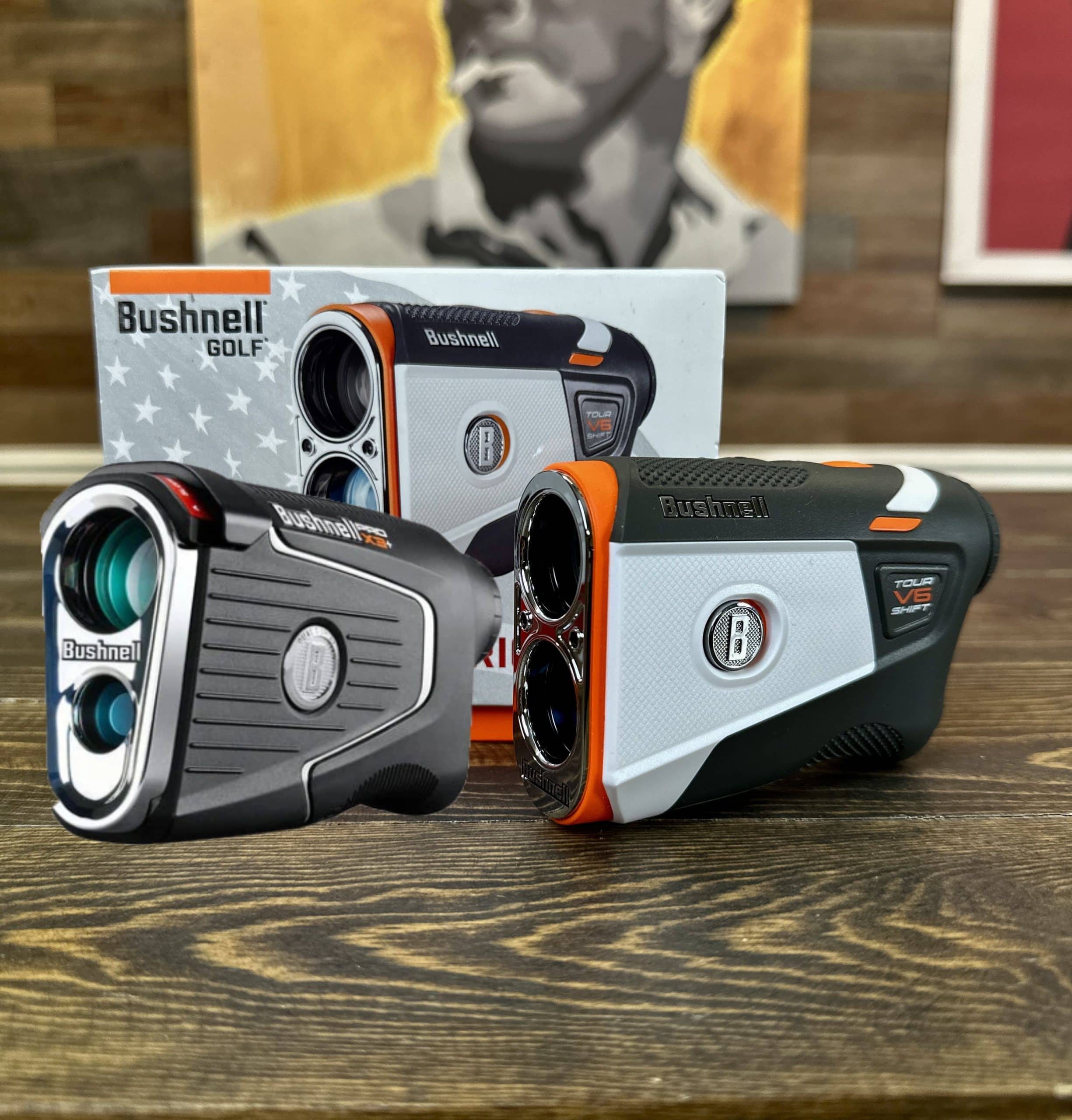 Bushnell golf rangefinders on wooden table