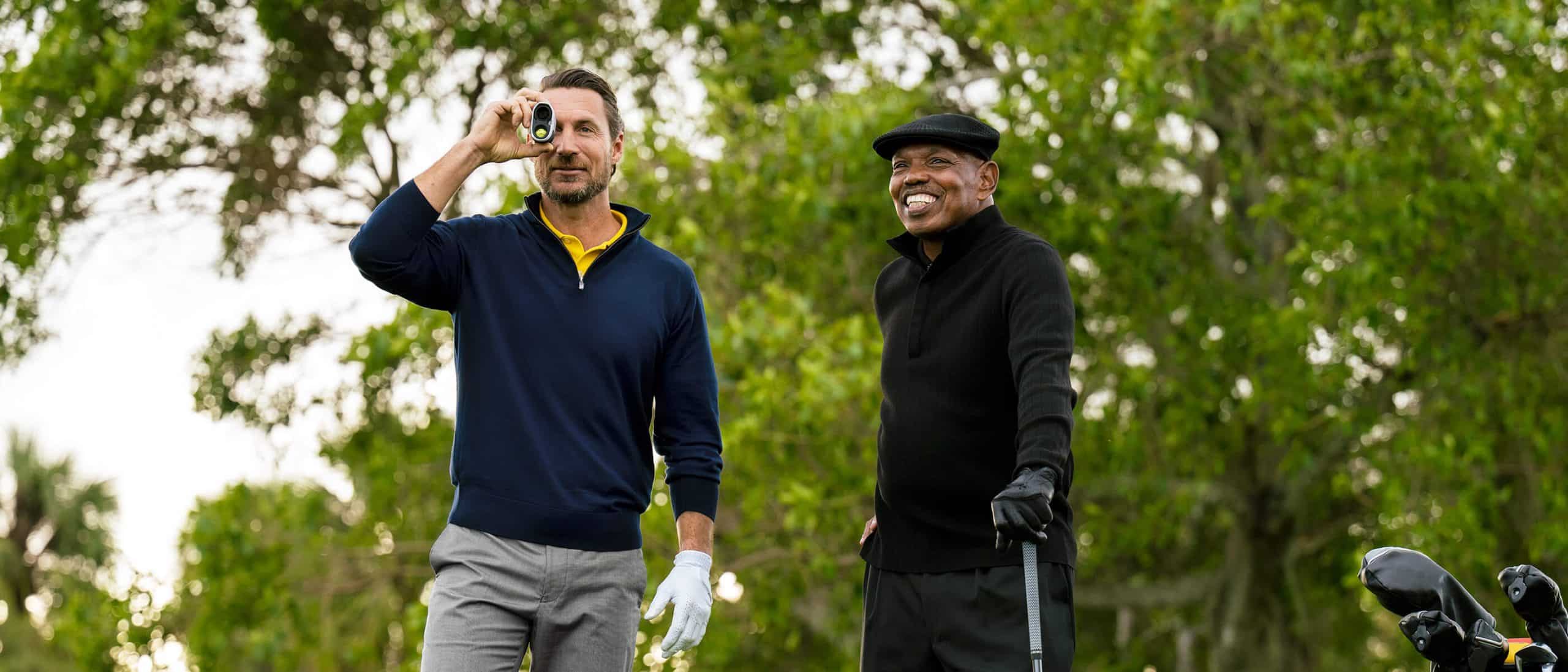 Two men golfing outdoors on a sunny day