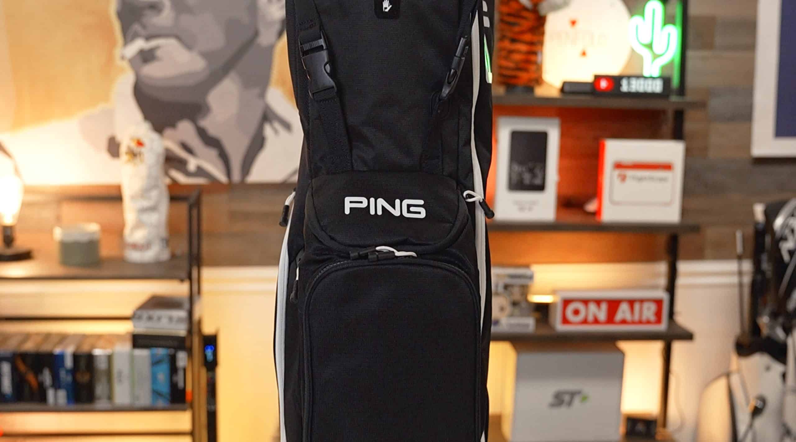 Black PING golf bag indoors on display