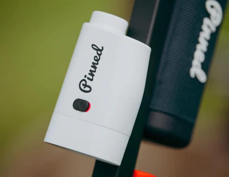 Pinned golf rangefinder with power button