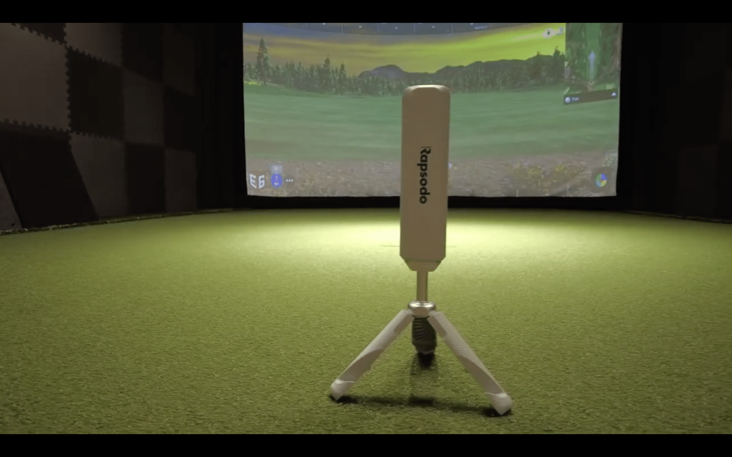Golf launch monitor in indoor simulator setup