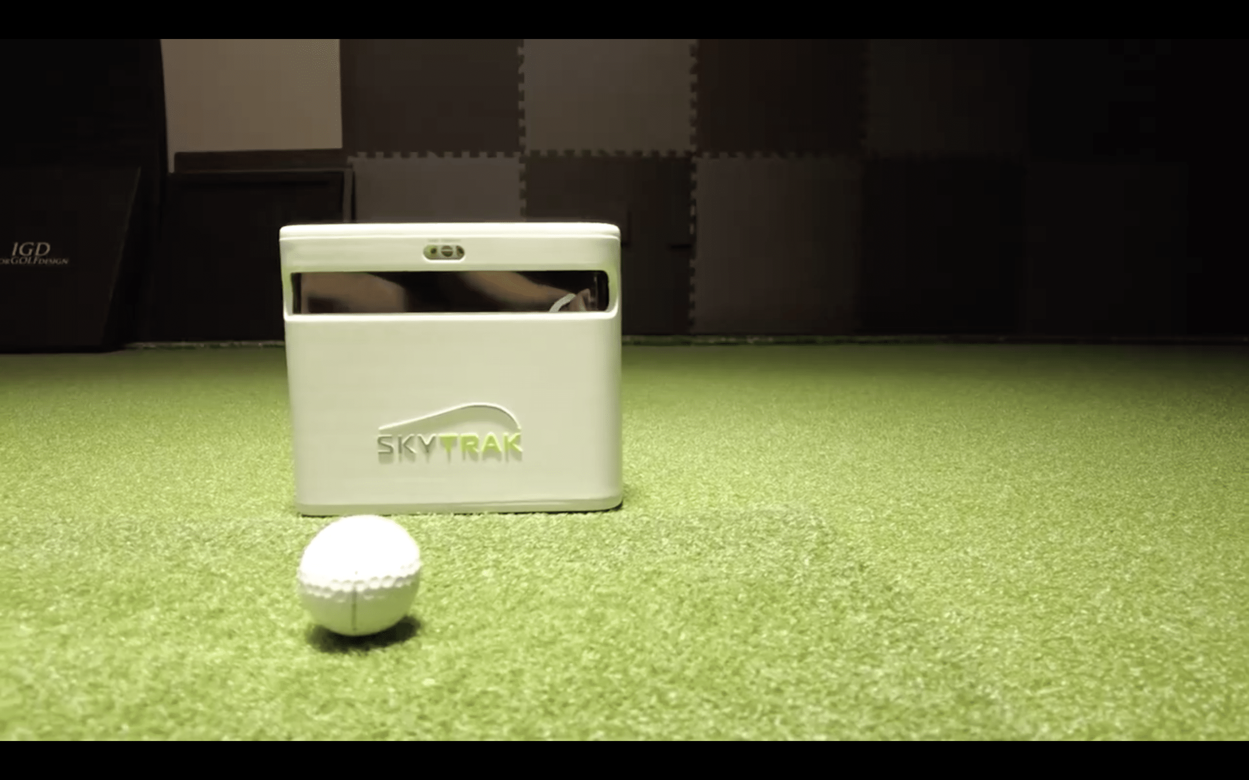 SkyTrak golf launch monitor with golf ball indoors
